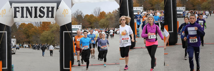 Runners crossing the finish line at Save Your Breath 5K.